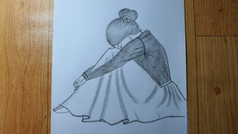 Hình vẽ cô gái ôm mặt buồn